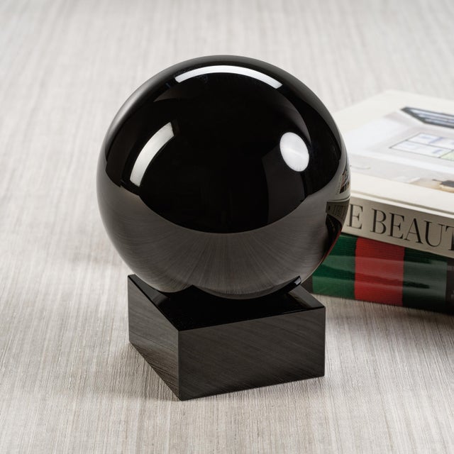 A simple but captivating decorative object that exudes timeless elegance. The square base not only provides stability but...