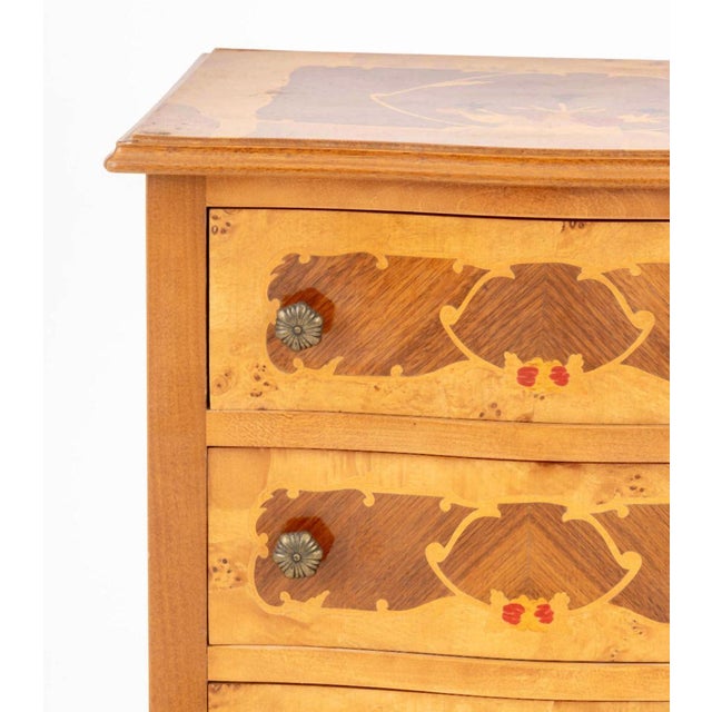 Louis XVI Style Floral Motif Marquetry Chest of Drawers, with three drawers and cabriole legs terminating in brass sabots....