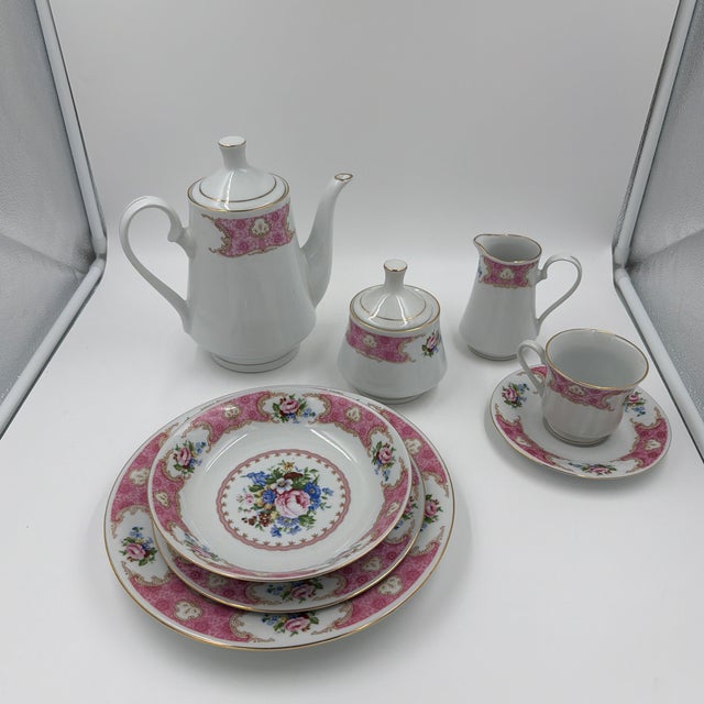 Bring timeless elegance to the table with this vintage 67-piece Remington Fine China dinnerware set in the beloved Red Sea...