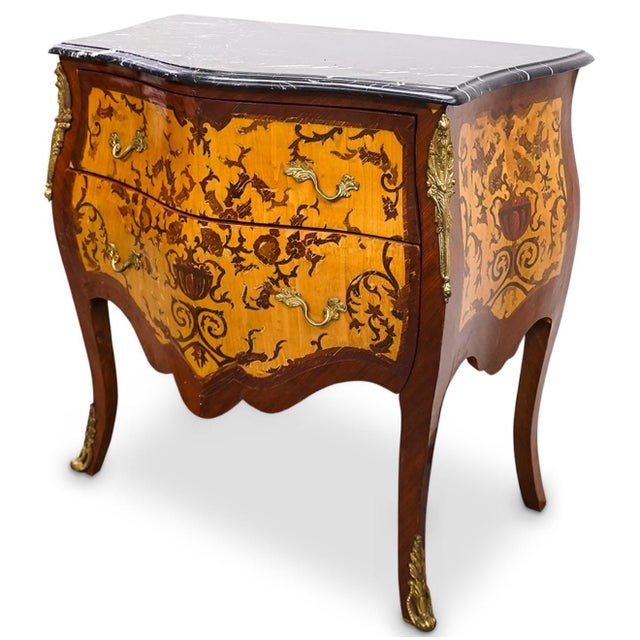 Antique French Bombé Two-Drawer Chest is a handsome example of Louis XV Rococo-style saturated with detail. The bombe...