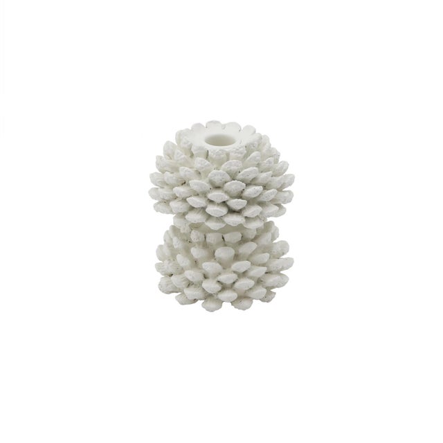 Crafted to hold a tapered candle, this candlestick captures the rustic beauty of the forest with its pine cone-inspired...