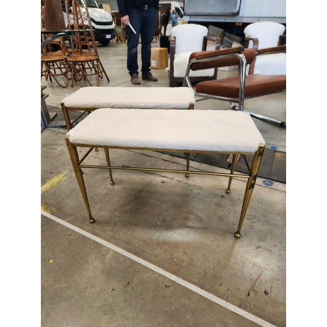 Pair of Vintage Italian Stools Appointed with decorative accents, this sturdy brass bench becomes a glamorous focal point....