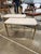 Pair of Vintage Italian Stools Appointed with decorative accents, this sturdy brass bench becomes a glamorous focal point....