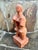 Striking modernist Cubist sculpture depicting an abstracted female figure, hand-modeled in terracotta clay. The form is...