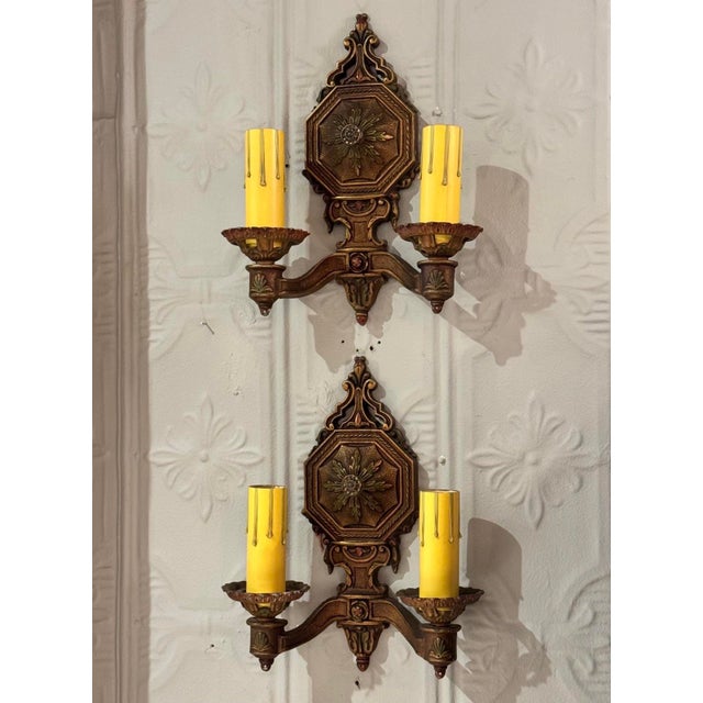 Excellent original finishes on these decorated early 1900’s wall sconces. Each has 2 new E26 sockets and new wiring. 11”...