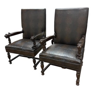 Early 20th Century Renaissance-Style Armchairs Featuring Carved Walnut Wood and Lion Head Armrests. For Sale