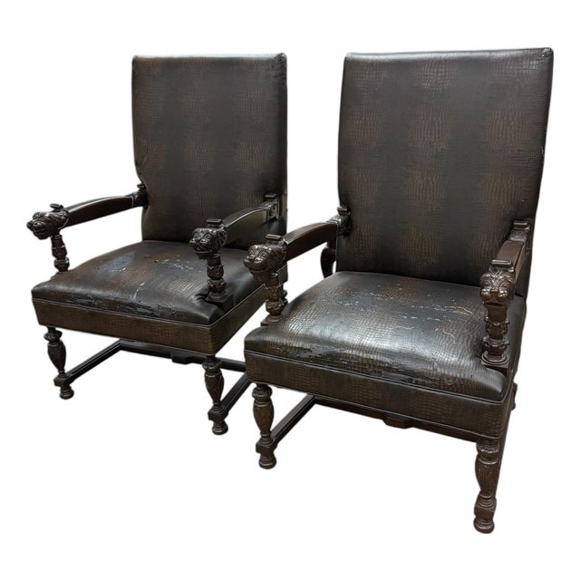 Early 20th Century Renaissance-Style Armchairs Featuring Carved Walnut Wood and Lion Head Armrests. For Sale
