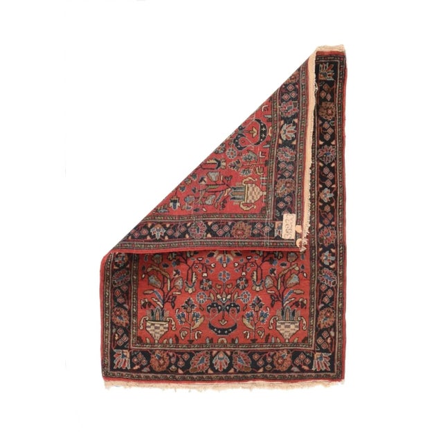 This relatively modern West Persian village scatter with an urban texture, shows a red-rose field with chequered corner...
