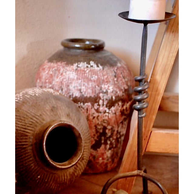 Thank you for your interest in our Pair of Antique Chinese Zhejiang Pottery Mijiu (Rice Wine) Storage Jars! Rich with...