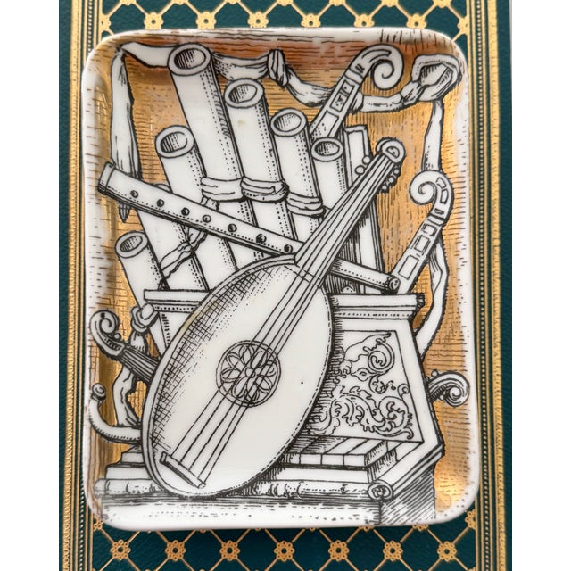 Two vintage mid-century trinket trays or catchall dishes with whimsical prints by prolific Italian artist and designer...