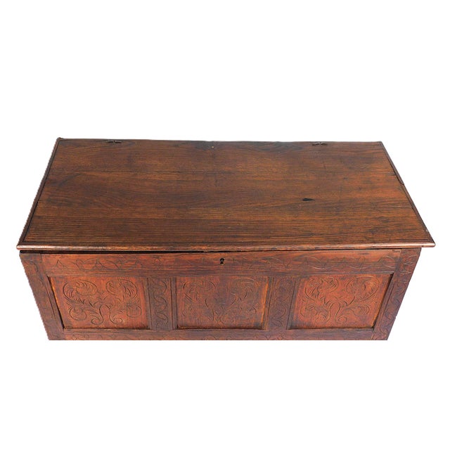 Pilgrims Chest, c. 1690-1720, with carved foliate decoration to front and sides, monogrammed “E. N.” on front, with sniped...