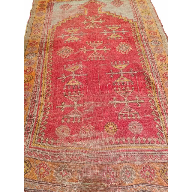 This exquisite vintage Turkish Anatolian area rug features a traditional prayer design handwoven in the early 1900s by...