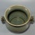 This antique Chinese Longquan celadon censer features two elegantly shaped side handles. The whole surface is covered with...