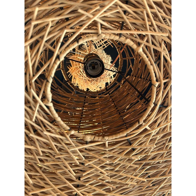 More information coming soon… Hand-crafted in France, the numerous strands of rattan that make up these pendant lights...