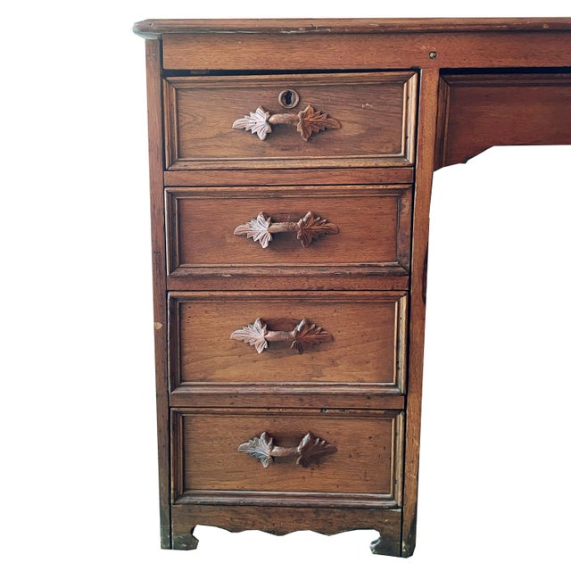 Absolutely stunning turn of the century arts and crafts era oak partners desk with all carved pulls intact and original...