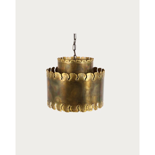 cut brass pendant light designed by svend aage holm sorensen. denmark, circa 1970s. sculptural layered form with flame-cut...