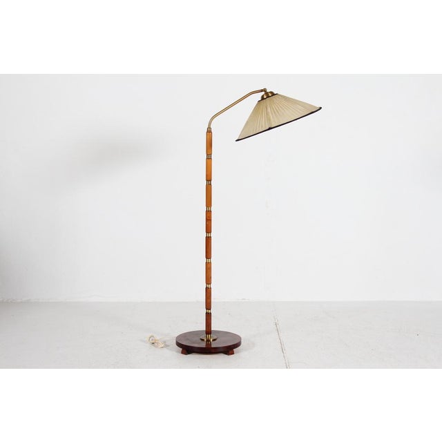Art deco floor lamp in Swedish Grace style made in the 1940s The stem and base is made of turned birch wood, mounted with...