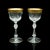 This is a pair of antique celebratory port glasses. A French, gilt decorated stem glass, dating to the Art Deco period,...