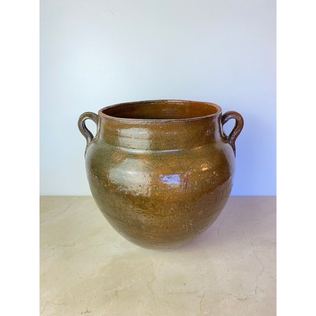 Antique French confit pot, hand-thrown terracotta from the Southwest of France, used historically for preserving duck and...