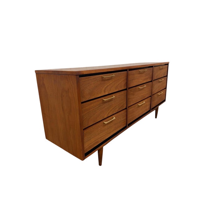 Add classic Mid-Century Modern style to your space with this striking Brasilia-style 9-drawer walnut dresser, beautifully...