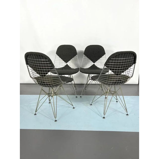 Good vintage condition with trace of age and use for this set of four Bikini chairs designed by Charles and Ray Eames for...
