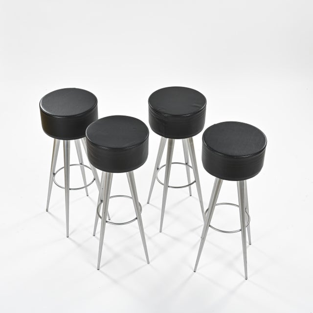 Set of four Golia stools designed by Maurizio Peregalli and produced by Zeus Noto in the early 1990s. Their gray lacquered...