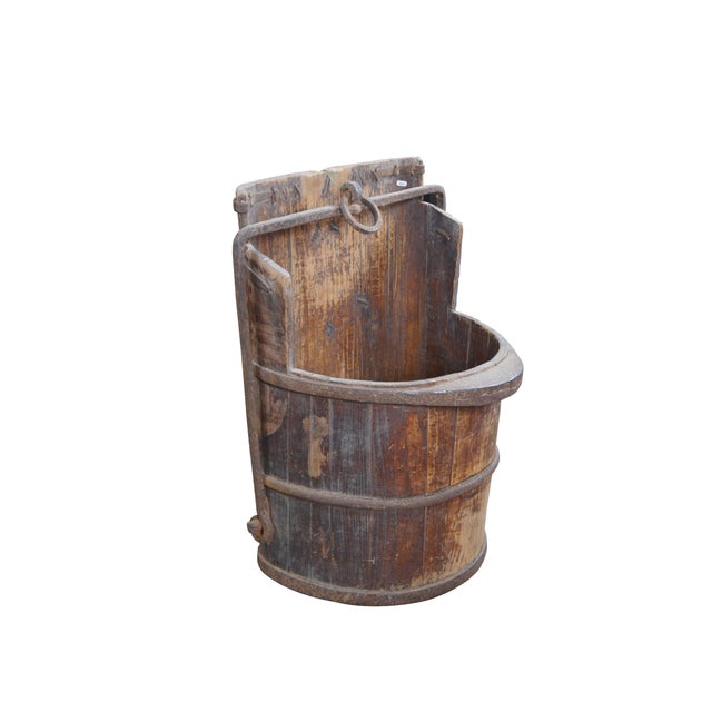 Primitive Chinese water bucket, circa 1890s-1910. Made elm and forged iron. Beautifully worn from years of use. A great...