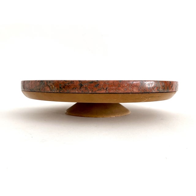 Custom red granite lazy Susan which spins on a wood composite base. A heavy and solid piece.