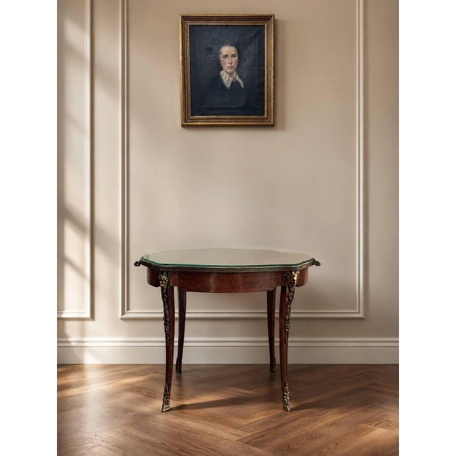 A beautifully decorative Italian parquetry inlaid tray table featuring a shaped top with geometric wood inlay, an inset...