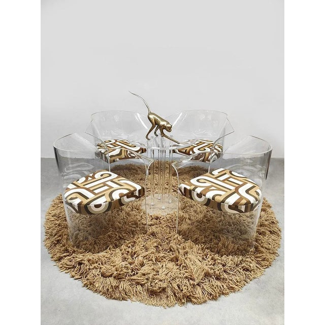 Rare find\. in other words, what a rare find: these unique transparent acrylic/resin chairs with a matching acrylic table....