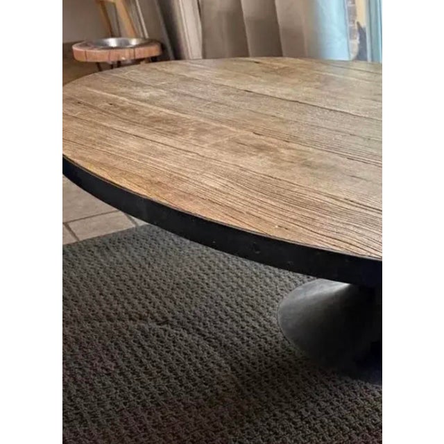 Difficult to find and expertly crafted, this solid, reclaimed wood and cast-iron coffee table is a true showstopper!...