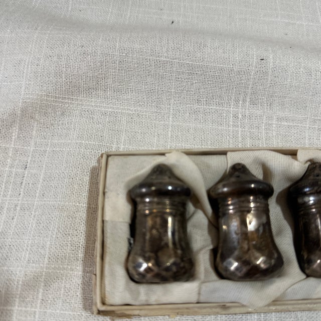 Up for consideration is a beautiful collection of sterling silver small salt shakers with a holding tray. These would look...