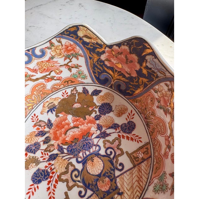 Antique Japanese Imari Porcelain Bowl | Meiji Period | Lobed Form | Flower Basket & Phoenix Panels For Sale In Atlanta - Image 6 of 8