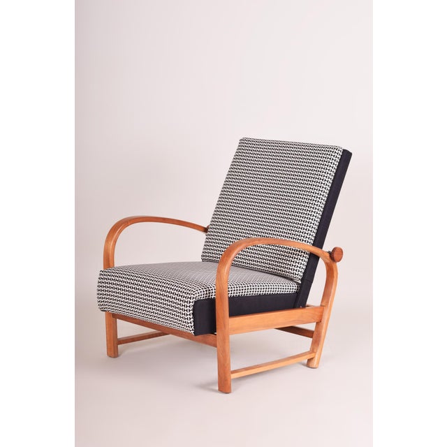 This elegant pair of armchairs, which dates back to the 1930s, was manufactured in Germany by the renowned and highly...