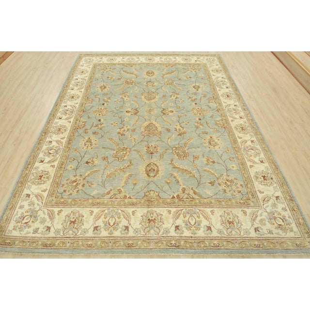 This modern traditional Ziegler rug is hand-knotted with an all-wool pile on a cotton foundation. This rug is new and in...
