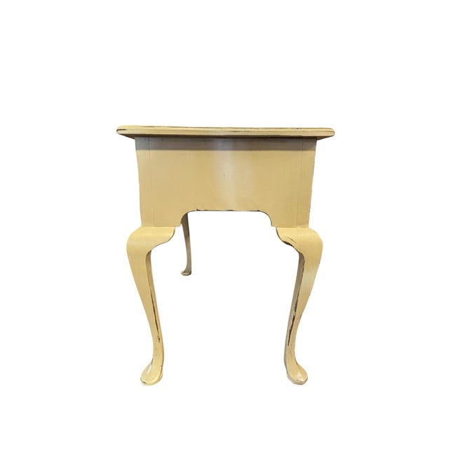 Graceful Queen Anne styling meets timeless cottage charm in this vintage three-drawer writing desk. Featuring elegant...
