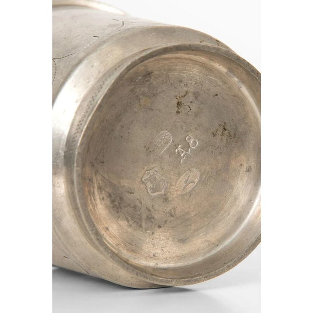 Pewter jar with lid designed by Edvin Ollers. Produced in Sweden. This piece is attributed to the mentioned...