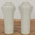 A very near pair of white porcelain tall and slender vintage altar vases with elephant handles, ring pulls and tapering...