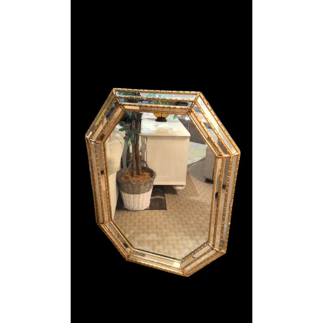 This stunning 20th-century pair of wall mirrors by LaBarge feature a striking octagonal design, with a combination of...