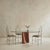 An Italian dining table from the 1970s, defined by its contrast of weight and transparency. A thick oval glass top rests...