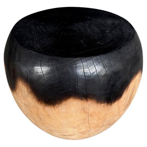 Reclaimed mango wood side table hand carved into an impressive drum shape. We partially stained the top half espresso and...