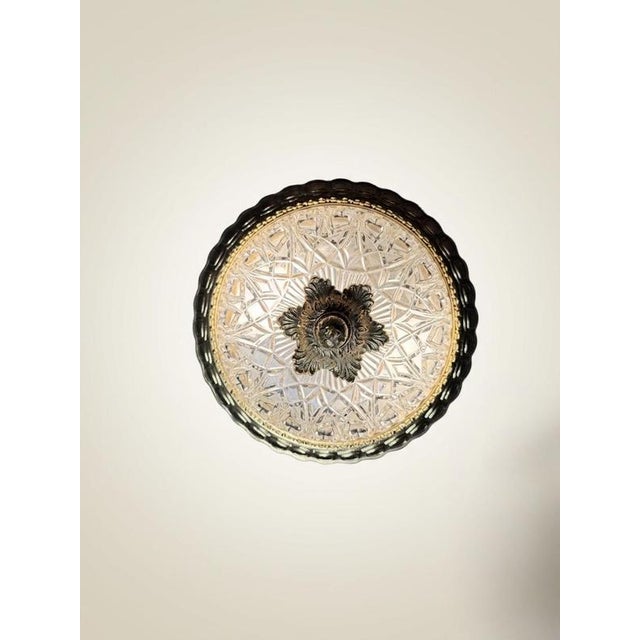 Add a touch of timeless sophistication to your home with this beautifully detailed brass and cut glass ceiling lamp. The...