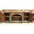 This piece features a distressed wood finish with metal corner brackets and decorative hardware that emphasize its rustic...