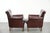 Offered is this set of two luxurious sheepskin armchairs with a timeless look and beautiful dark colors. This luxurious...