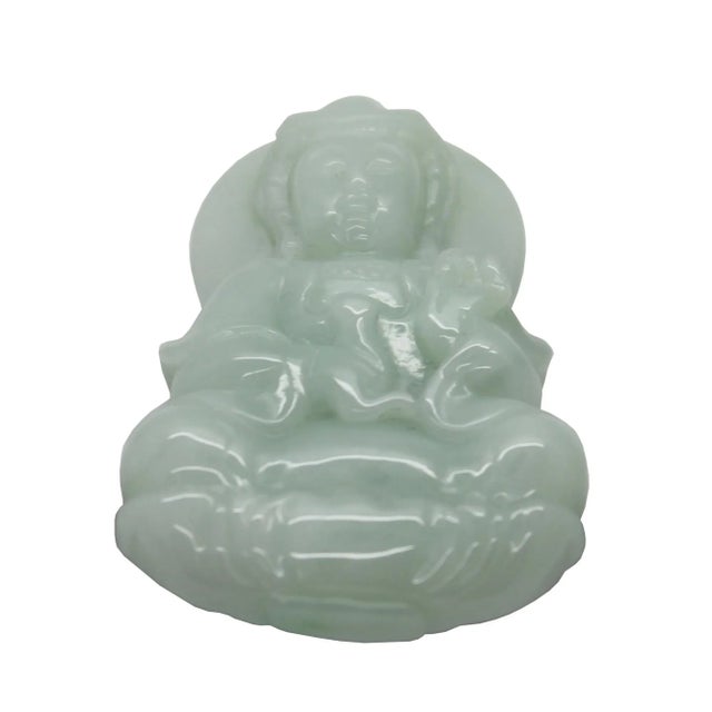 This beautiful pendant is carved from natural untreated jade, the motif of this pendant is a Kwan Yin meditate sitting on...