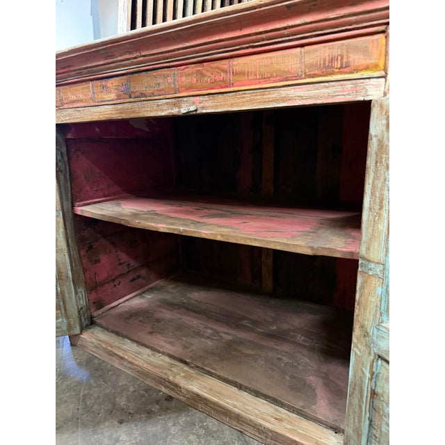 Make a bold statement with this antique hand-carved sideboard cabinet, beautifully finished in a distressed blush pink...