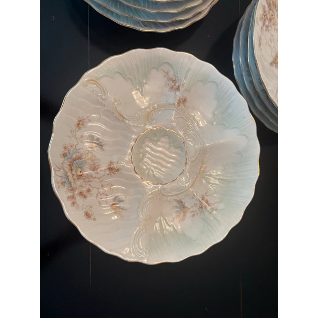 Absolutely stunning oyster plates by Weimar. There are 4 blue, 4 pale green and 4 pink plates. Each is hand painted in...