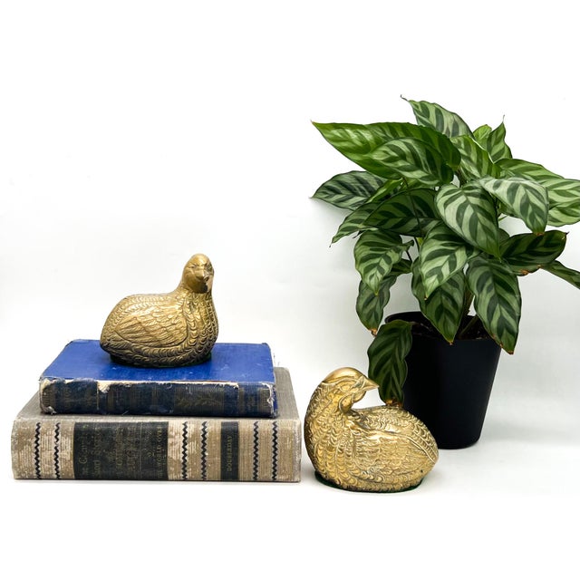Delightful pair of mid-to-late 20th century brass quail figurines with beautifully detailed feathering and a warm, time-...