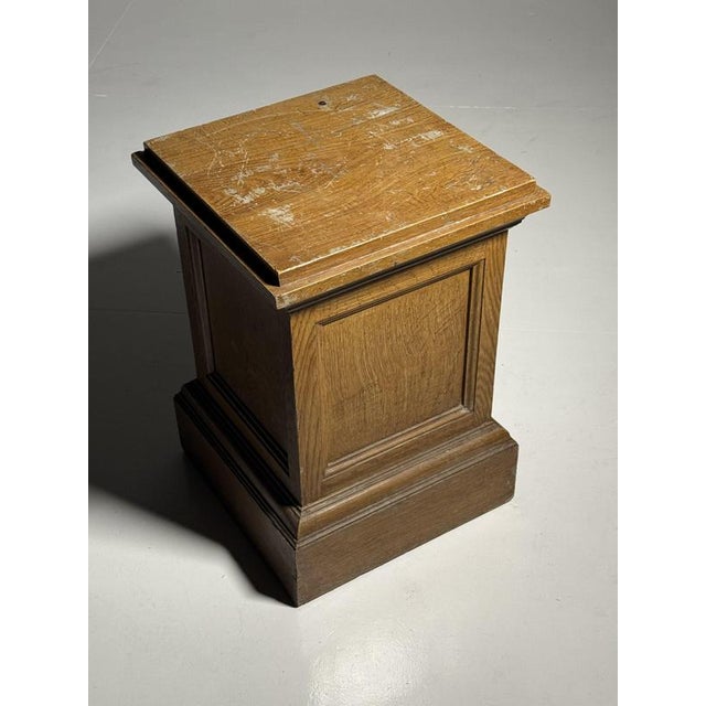 Classic column / pedestal. Crafted from solid pine wood. Painted in faux bois oak. This makes the pedestal very...