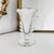 An authentic A. H. Heisey & Company footed cabinet vase in the Lariat pattern with Orchid etching, produced in Newark,...